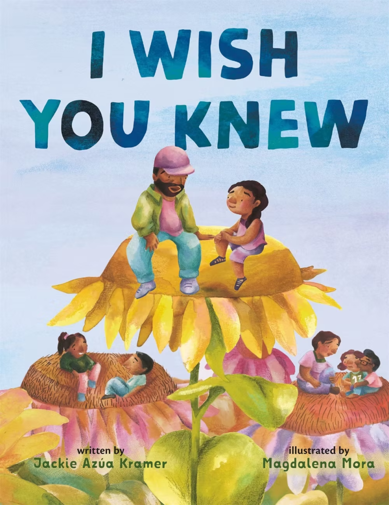 Cover of the children's book 'I Wish You Knew' featuring a father and daughter sitting on a giant sunflower, with illustrations of children playing on other sunflowers in the background.